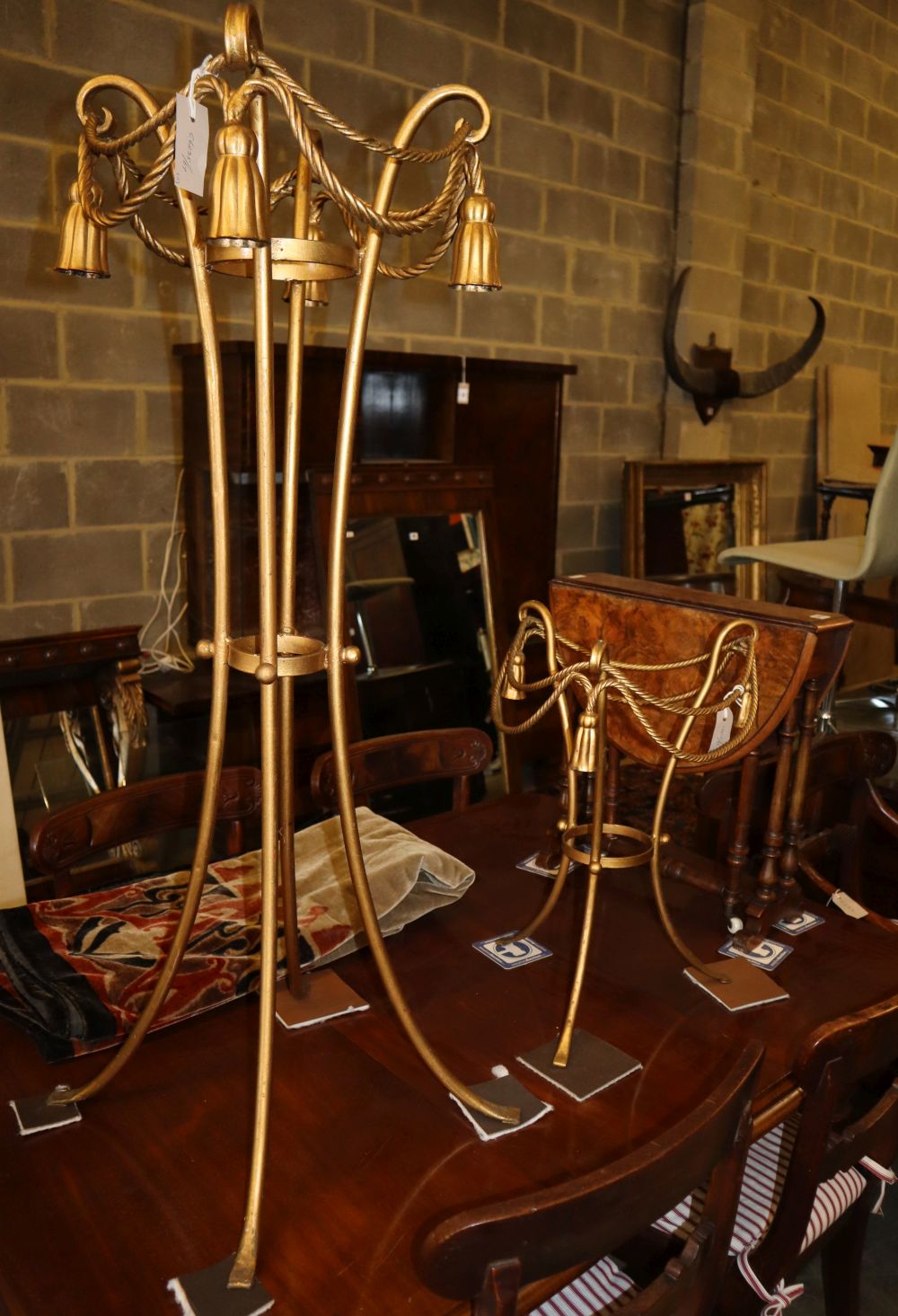 A gilt metal jardiniere stand and a matching occasional table (both lacking glass tops), stand H.113cm